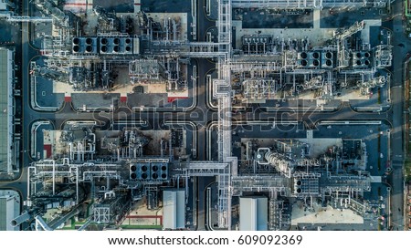 Aerial top view oil and gas refinery background, Business petrochemical industrial, Refinery oil and gas factory power and fuel energy,  Ecosystem and healthy environment concepts.