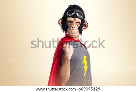 Lucky Superhero monkey man on ocher background