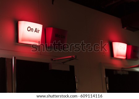 On air sign above broadcasting room door. Royalty-Free Stock Photo #609114116