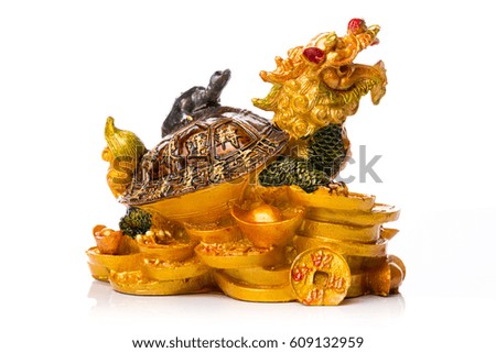 Figure of golden dragon in turtle shell on isolated white background.