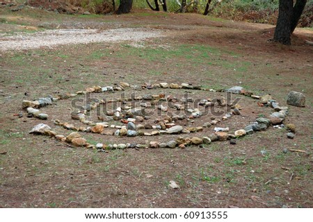 Spiral shape made from stones in a forest.