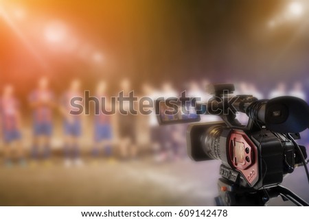 Blurred Video camera camera taking video football player background 