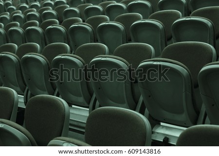 Grey audience bleachers with chairs