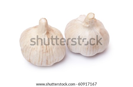 Aromatic, fresh garlic on a white background. / Two garlic.
