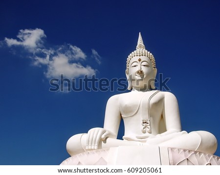 White Buddha statue and blue sky