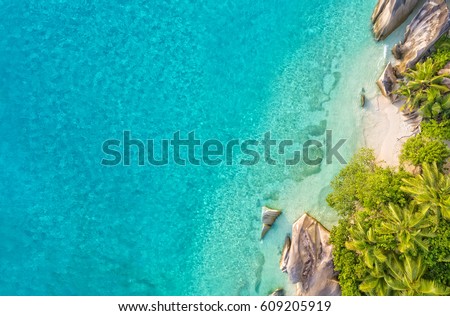 Aerial photo of beautiful paradise Seychelles tropical beach Anse Source D Argent at La Digue island. Summer vacation and travel concept