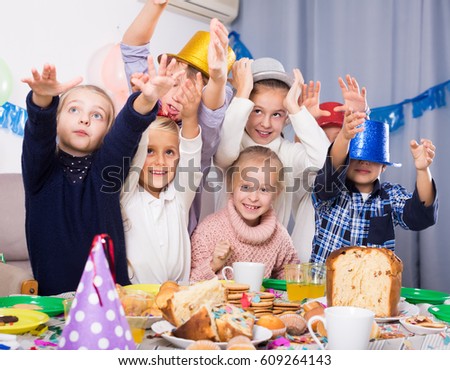 Group active children having fun during birthday party