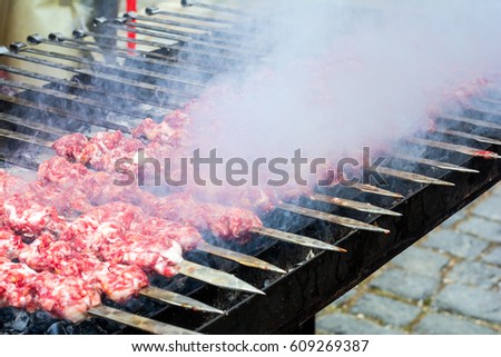 Marinated kebab preparing over charcoal