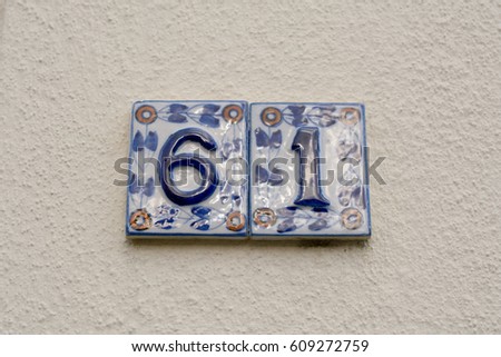 House number 61 sign in ceramic tiles
