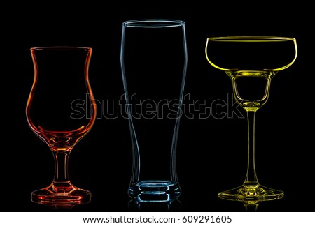 Silhouette of multicolor different glasses on black background