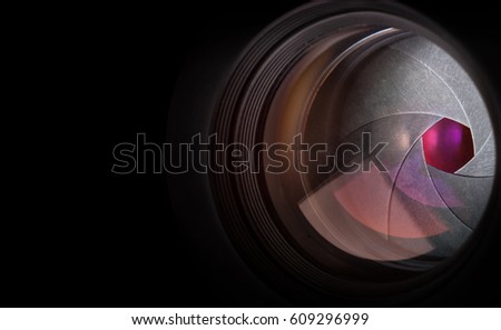 Camera lens on black background.