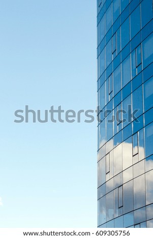 Modern office building, with a clean view of the sky. Banking and corporate facade glass building concept.