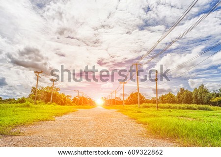 Light brown stone crossroad image with clouds and electric poles at countryside Thailand of ASian.