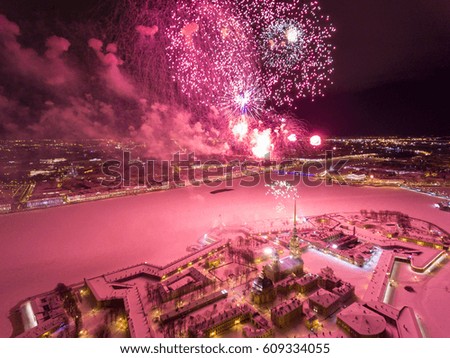  Aerial view of Fireworks over the Peter and Paul Fortress, Palace bridge, Old Stock Exchange, Winter Palace, Hermitage, night illumination, river Neva as mirror, snow, Rostral Columns with fire