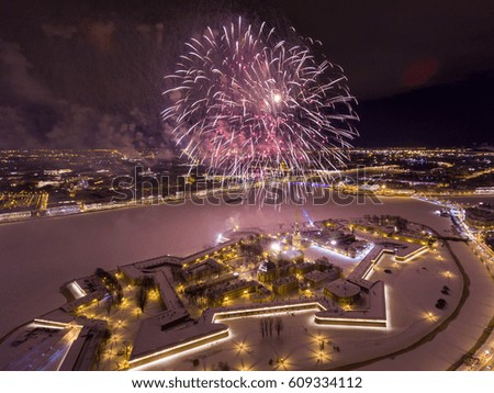  Aerial view of Fireworks over the Peter and Paul Fortress, Palace bridge, Old Stock Exchange, Winter Palace, Hermitage, night illumination, river Neva as mirror, snow, Rostral Columns with fire