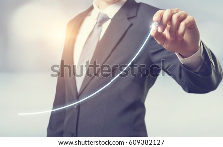 Development and growth concept. Businessman plan growth and increase of positive indicators in his business. Royalty-Free Stock Photo #609382127