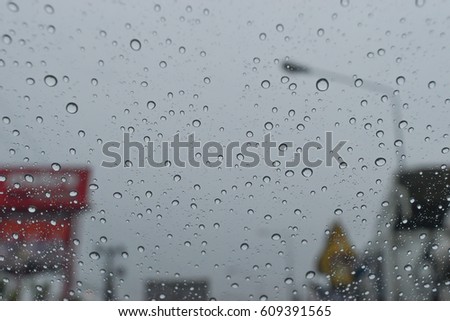 Water droplets on car glass.