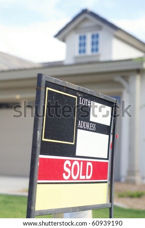 House sold sign on sign board outside home