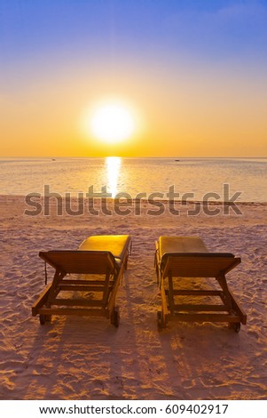 Loungers on Maldives beach - nature vacation background