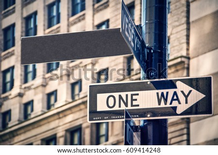 Blank sign and one way roadsign in New York City, USA