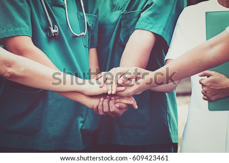 Group of Doctors and nurses coordinate hands. Concept Teamwork in hospital for success work and trust in team Royalty-Free Stock Photo #609423461