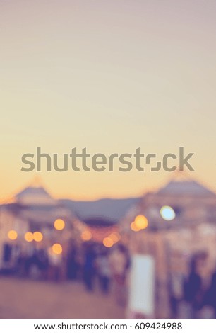 abstract blur image of retail shop at day festival for background usage . (vintage tone)