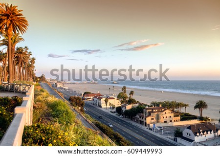 View of Pacific Coast Highway at Santa Monica beach, ocean front homes as seen from Palisades park, in southern California. Royalty-Free Stock Photo #609449993
