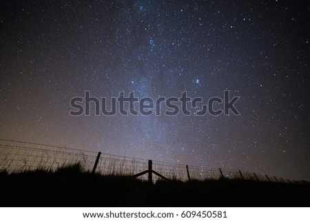 Milky Way over a barbed wire fence