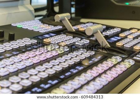 Video switch of Television Broadcast with blurry background, control broadcasts in recording studio., Photo of the TV broadcasting working with video and audio mixer
