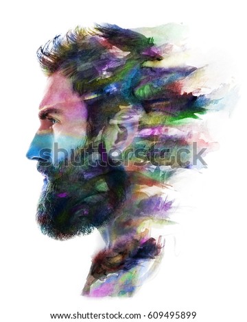 Profile portrait of a young, attractive, bearded man combined with colourful watercolour painting dissolving