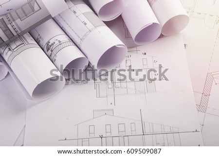 Workplace of architect - construction drawings on the table
