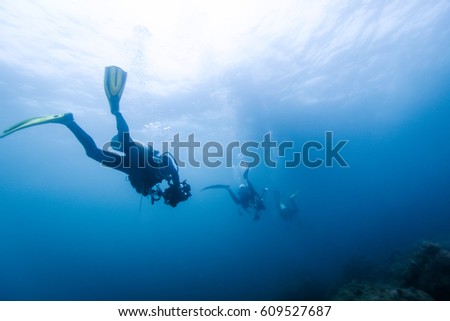 Diver silhouette under water