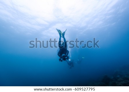 Diver silhouette under water