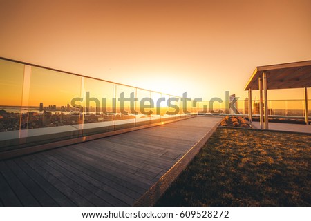 Sun-Drenched Luxury Rooftop Deck at Sunset