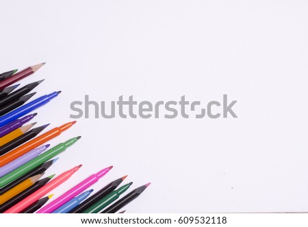 Diagonal fragment of opened colorful markers;