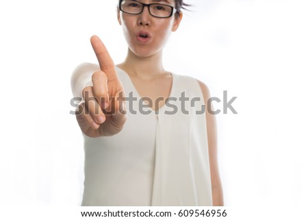young asian woman pointing finger and say no on isolated white background.