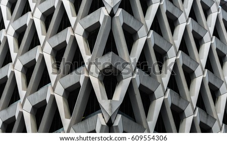 Detail of brutalist concrete diamond shaped facade of the car park in Welbeck Street , London. Royalty-Free Stock Photo #609554306