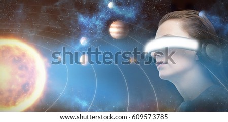 Low angle view of woman trying virtual reality against graphic image of various planets with sun 3d