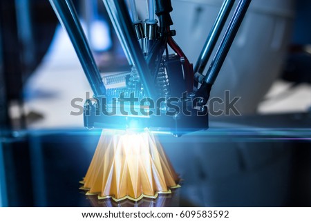 3D printing machine during work process Royalty-Free Stock Photo #609583592