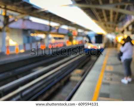 Blurred image of train station before sunset , BTS skytrain at Bangkok, Thailand