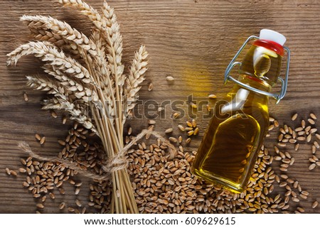 Wheat grain and wheat germ oil Royalty-Free Stock Photo #609629615