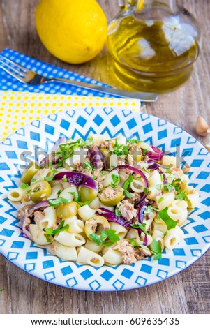 Pasta with tuna, olives, lemon, onions, nice presentation, delicious dinner, healthy food