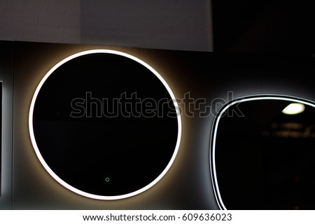 Abstract dark mirror with back light. Black mirror with glowing light. Evil mirrors