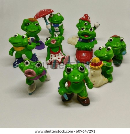 Frogs toys on a white background