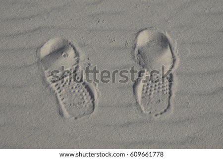 Foot prints in the sand - every journey starts with a single step.