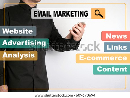 Email Marketing concept. A man with a mobile phone in the background