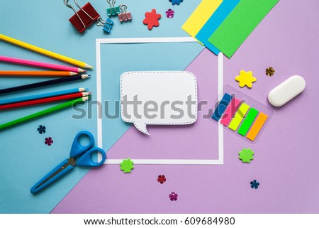 Back to school, square frame with stationery on blue and violet background. flat lay.