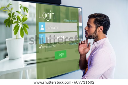 Close-up of login page against thoughtful man looking over whiteboard