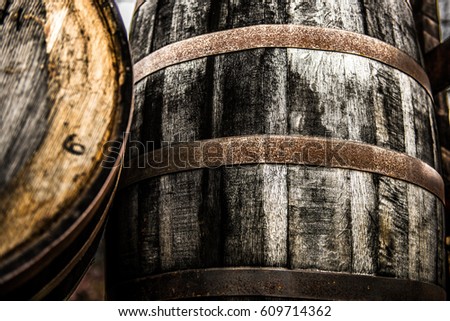 Vintage rustic bourbon barrel in front of building in Frankfort, Kentucky on the Bourbon Trail.  Royalty-Free Stock Photo #609714362