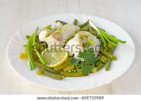 Cod fillet steamed with green beans. Concept of healthy food.